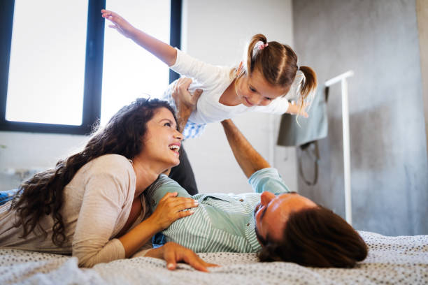 istock Happy family having fun times at home 1248951511