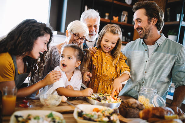 istock Cheerful family spending good time together while cooking in kitchen 1248951568