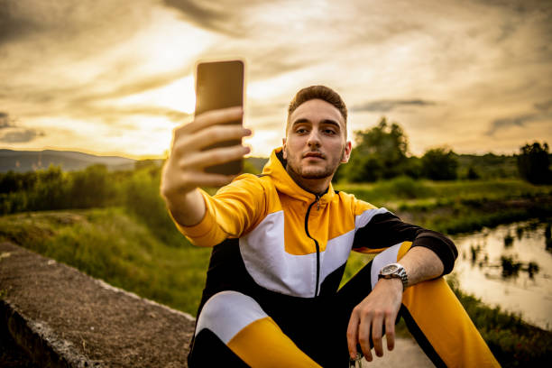 istock The young man sits in nature and enjoys the sunset 1248951809