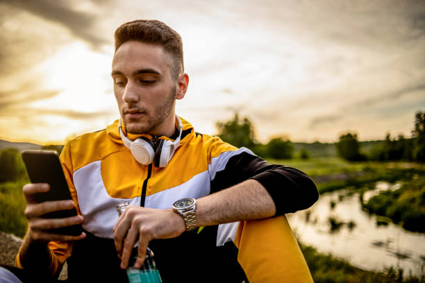 istock The young man sits in nature and enjoys the sunset 1248952614