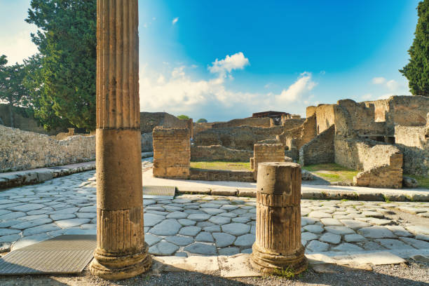 Looking at the TRIANGULAR FORUM at the city of Pompeii. Pompeii is an ancient Roman city that was buried under 4 to 6 m (13 to 20 ft) of volcanic ash and pumice in the eruption of Mount Vesuvius in AD 79. Today Pompeii is a UNESCO World Heritage Site and is one of the most popular tourist attractions in Italy.