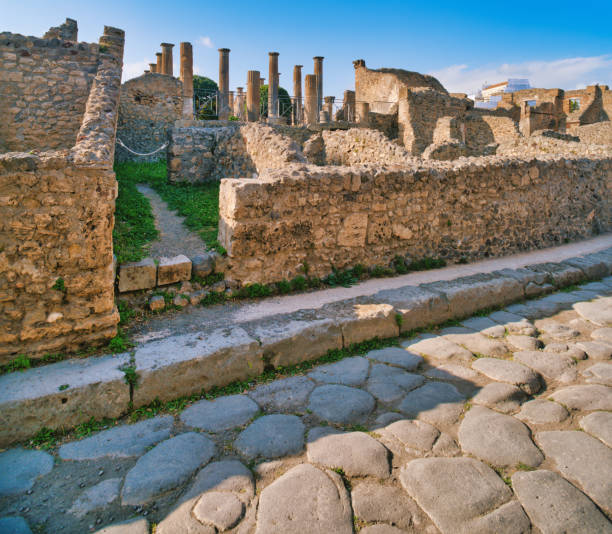 Looking at the ancient city of Pompeii. Pompeii is an ancient Roman city that was buried under 4 to 6 m (13 to 20 ft) of volcanic ash and pumice in the eruption of Mount Vesuvius in AD 79. Today Pompeii is a UNESCO World Heritage Site and is one of the most popular tourist attractions in Italy.