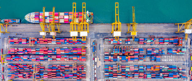 istock Top view of  Deep water port with cargo ship and container 1248955069