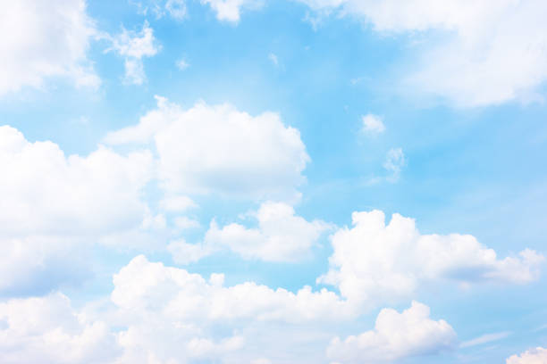 istock Pastel blue sky with white haep clouds 1248956368