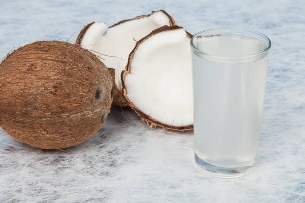 istock Healthy and natural coconut water; photo on neutral background. 1248961908