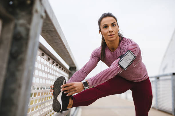 istock Young sportswoman warming up before training outdoors 1248963254