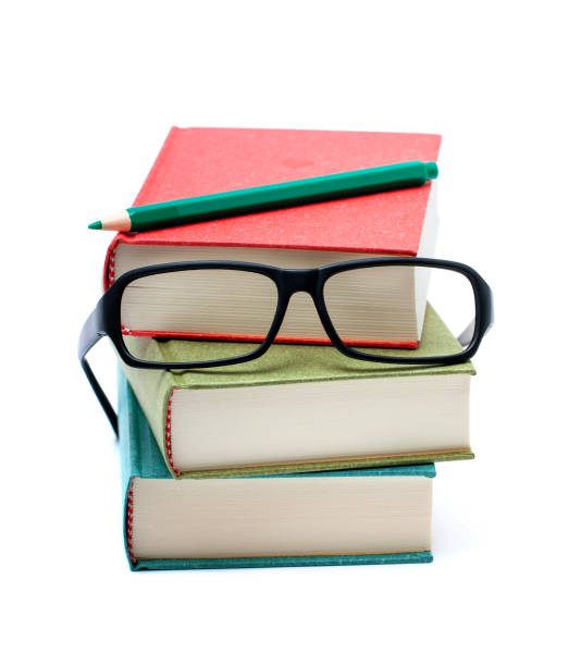 istock Books and eyeglasses isolated on white background 1248964623