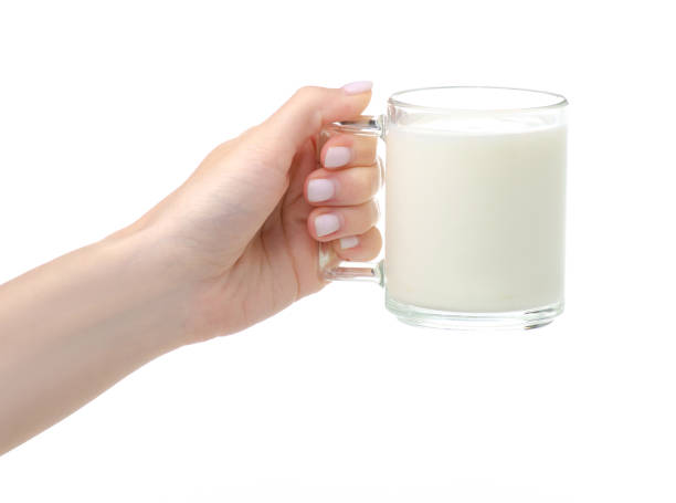 istock Glass cup of milk in hand 1248964922