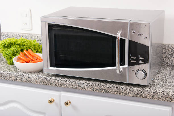 istock Microwave oven; photo in kitchen environment. 1248964954