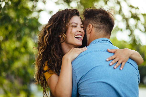 istock Couple in love embracing in spring park 1248965028