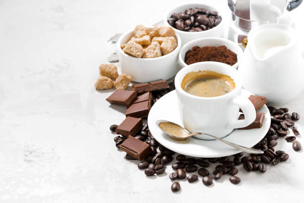istock fresh coffee, chocolates and sweets on white background, closeup 1248965910