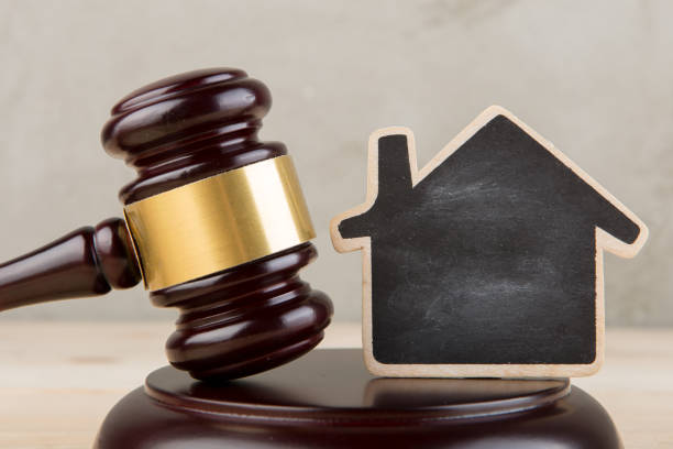 Real estate concept -auction gavel and little house with copy space stock photo