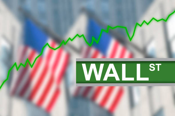 Wall Street sign post with green line chart diagram indicating stock market going up. In the background blurred American US flags hanging from buildings Wall Street sign post with green line chart diagram indicating stock market going up. In the background blurred American US flags hanging from buildings in New York City. trader wall street stock market analyzing stock pictures, royalty-free photos & images