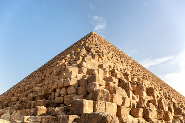 Giza pyramid detail Closeup detail of a Pyramid, Giza, Egypt, against blue sky. The Great Pyramid of Giza is the only remaining of the original Seven Wonders of the world. pyramid giza pyramids close up egypt stock pictures, royalty-free photos & images