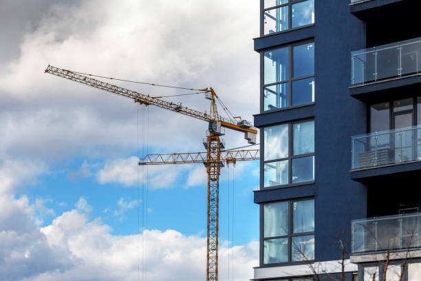 istock Construction of a modern residential complex. The construction of a multi-story building. cargo crane 1248968132