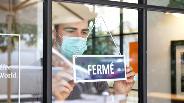 French small business closing during COVID-19 pandemic French small business closing during COVID-19 pandemic. french language photos stock pictures, royalty-free photos & images