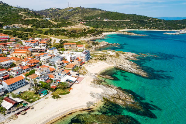 Aerial view of Sarti on the Sithonia peninsula, in the Chalkidiki , Greece Aerial view of Sarti village on the Sithonia peninsula, in the Chalkidiki , Greece halkidiki beach stock pictures, royalty-free photos & images