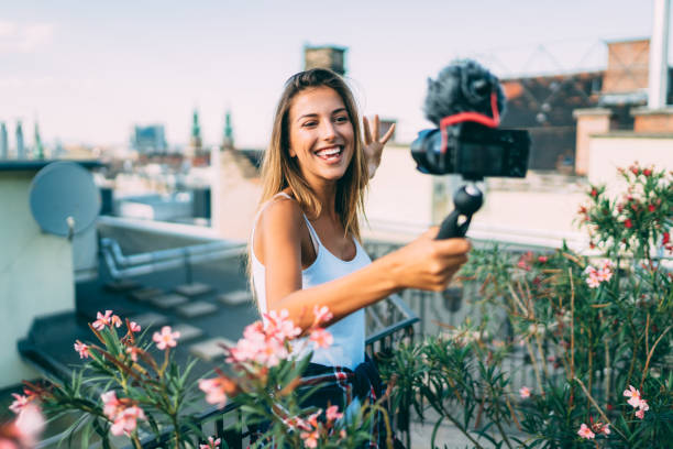 istock Influencer vlogging from a travel destination 1248972437