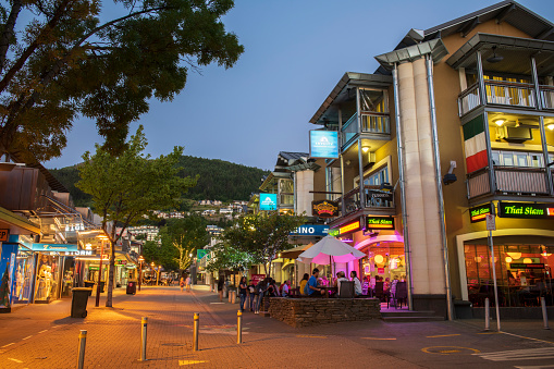 Queenstown, New Zealand - December 25, 2018. Downtown Queenstown with people dining outdoor on South Island, New Zealand.