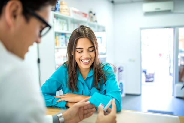 istock Charming young woman shopping at pharmacy 1248973880