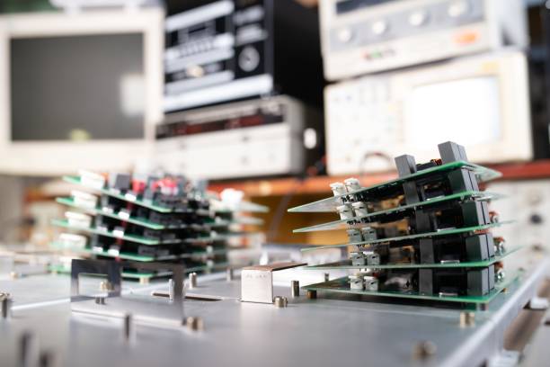 Microchips are stacked on top of each other on metal plates in the manufacture of super modern powerful computer equipment for a modern cardiology clinic. Powerful specialized computers concept