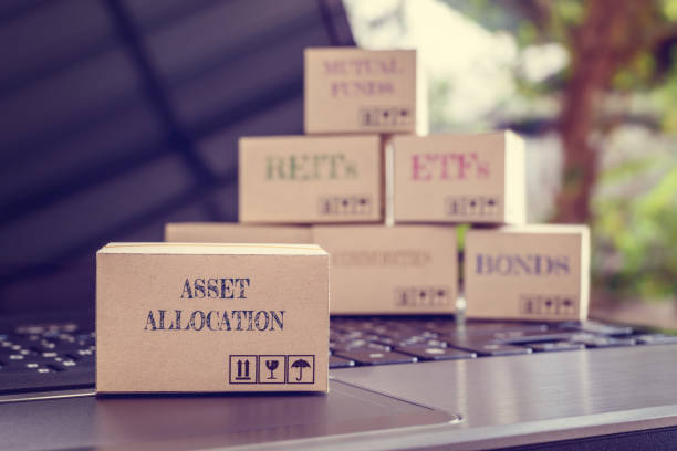 istock Boxes of financial products e.g asset allocation, bond, commodities, stocks, ETFs, REITs on a laptop 1248975295