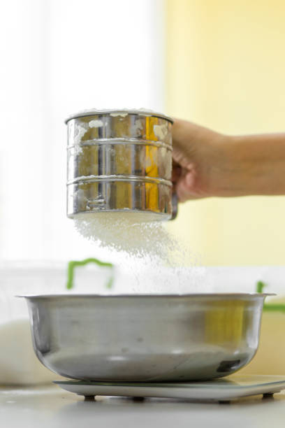 istock Cooking Baking. Cook sifts the flour a 1248977162