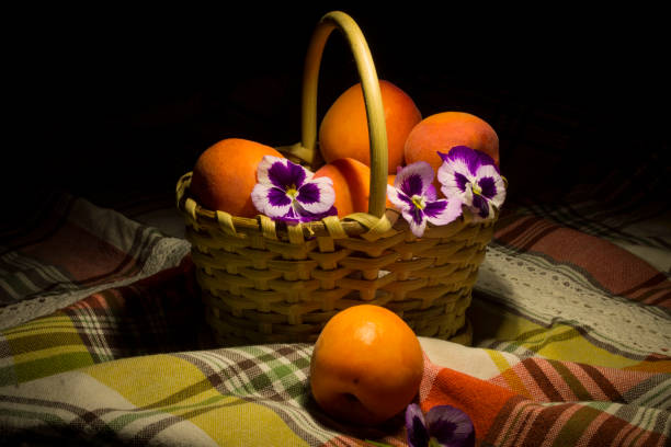 Group of fresh apricots with pansy