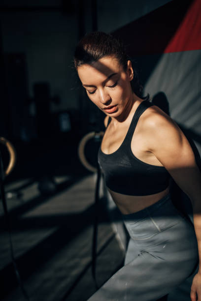 istock Beautiful fit woman alone in gym 1248981805