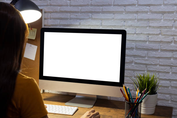 istock woman working empty screen computer mockup on wood desk in office. 1248982638