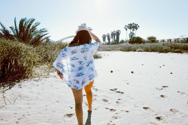 istock travel girl on beach vacation 1248986129
