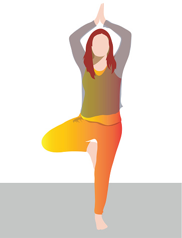 Red haired  women in vrkasana pose yoga pose, wearing a yellow & orange solid colour workout outfit