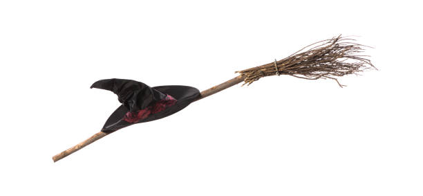 istock witch hat and broom isolated on white background 1248992053