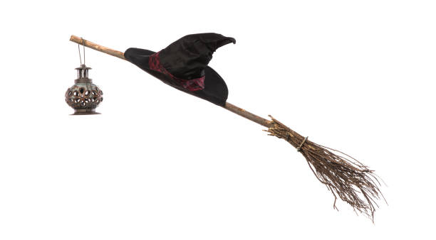 istock witch hat and broom isolated on white background 1248992299