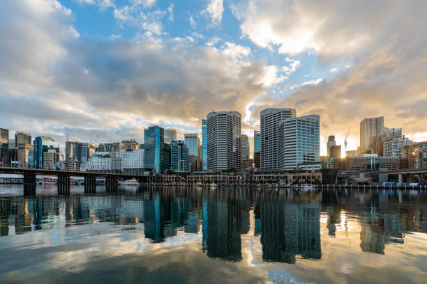 sydney downtown skyline at darling harbor bay, business and recreational arcade, at sunrise - darling harbor imagens e fotografias de stock