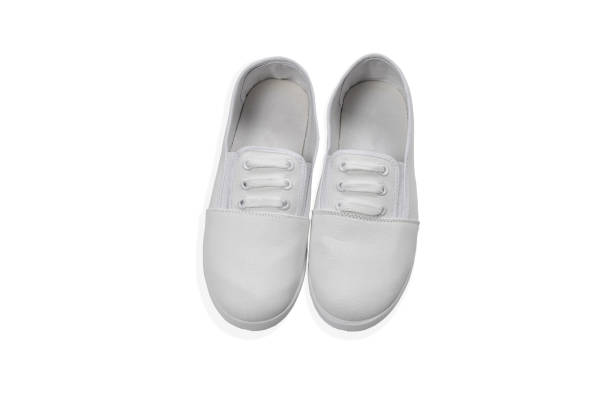 istock blank pair of white textile sneakers isolated on white background 1248997459
