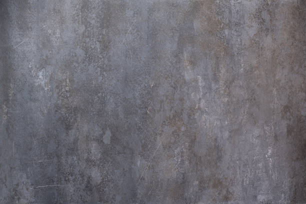 istock Dark grunge stone textured wall closeup 1248997613