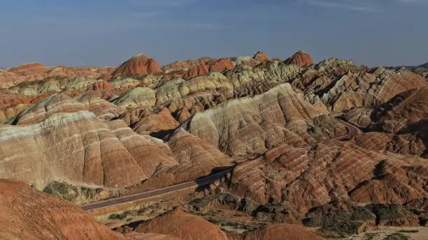 Spectacular colorful rusty sandstone and siltstone landforms of Zhangye Danxia-Red Cloud Nnal.Geological Park so called Rainbow Mountains-E.foothills of the Qilian Range. Zhangye-Gansu province-China.