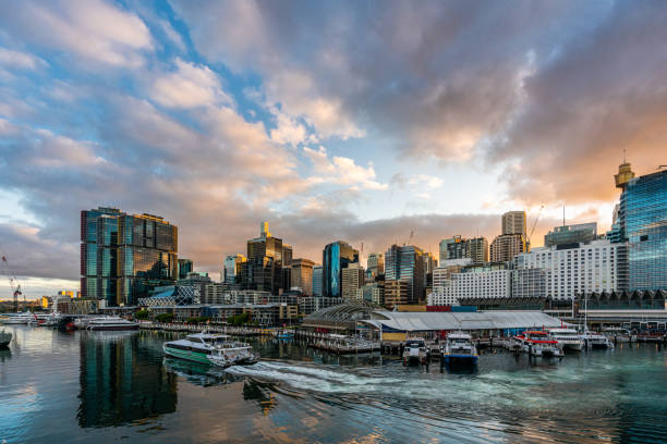 sydney downtown skyline at darling harbor bay, business and recreational arcade, in sydney, nsw, australia at sunrise - darling harbor imagens e fotografias de stock