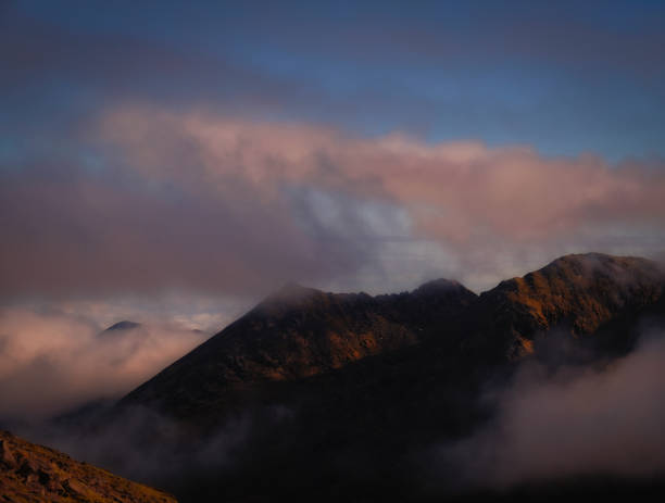 istock Mountains in sunset tones 1248999279