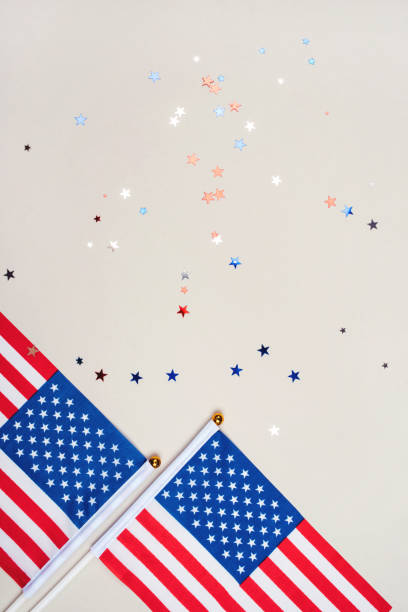 istock Festive background with US flags and confetti. 1249000144