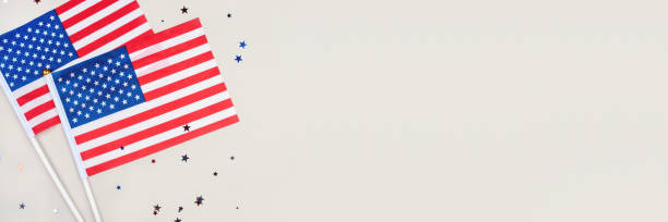 istock Festive background with US flags and confetti. 1249000148