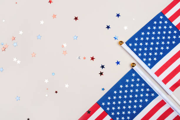istock Festive background with US flags and confetti. 1249000150