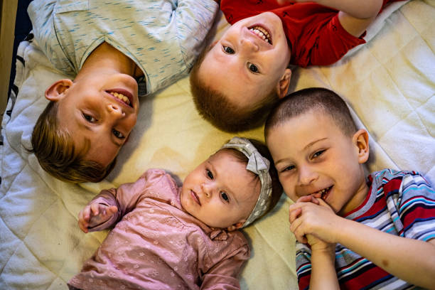 istock View above kids on bed 1249002174