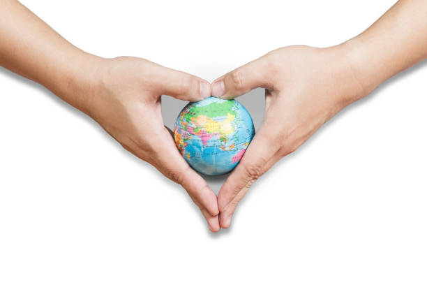 istock Two hand (heart shape) are holding globe isolated on white background. 1249002471