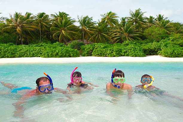 istock Family snorkeling in water 124900306