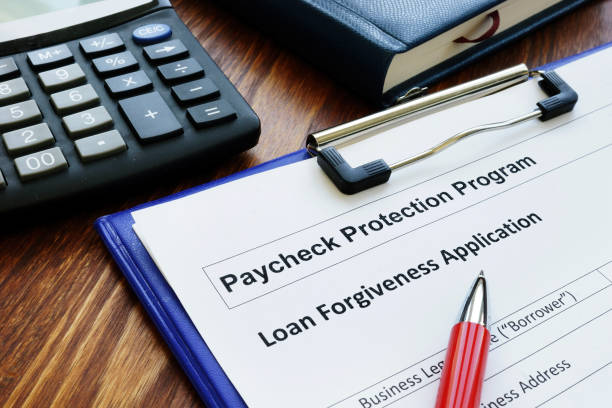 Paycheck protection program ppp loan for small business forgiveness application. Paycheck protection program ppp loan for small business forgiveness application. employment document stock pictures, royalty-free photos & images