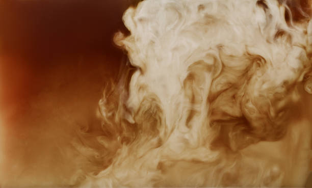 istock Closeup mixing of milk with coffee 1249012727
