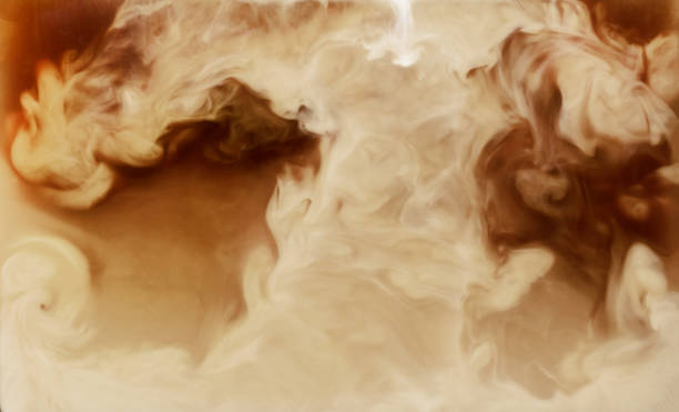istock Closeup mixing of milk with coffee 1249012895