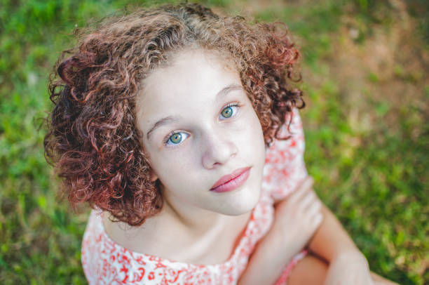 Portrait of a young woman, looking at the camera.